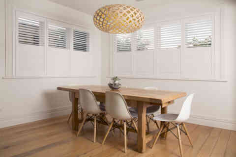 Shutters in Dining Room Wooden Table with White Chairs